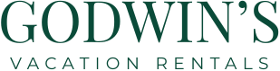 Godwin's International Realty Vacation Rentals logo.